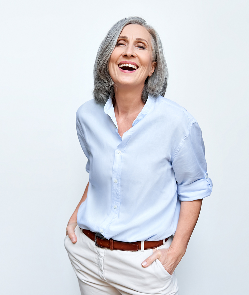 Photo of a happy older woman in business casual clothes