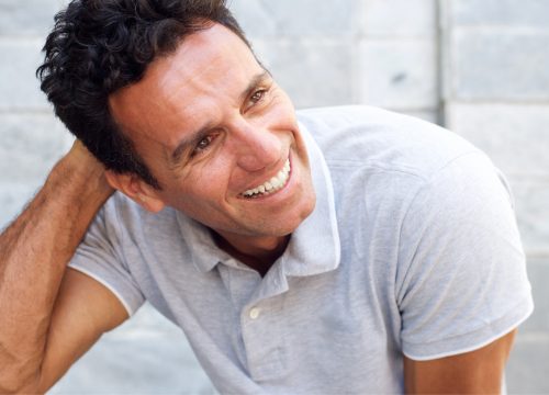 Photo of a smiling middle age man with a full head of hair