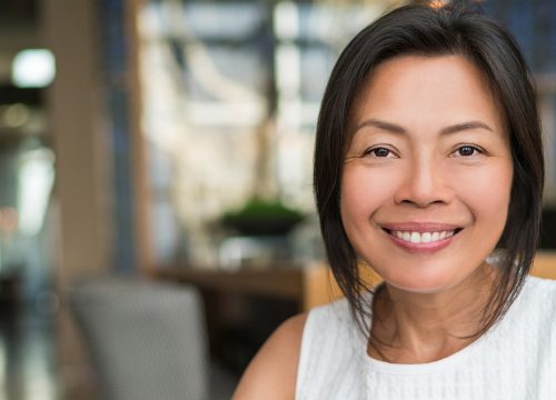 Photo of a smiling, middle age Asian woman